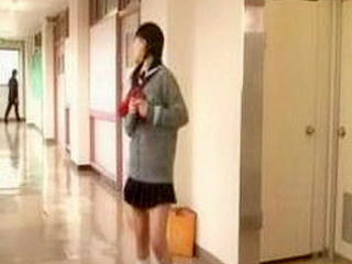 Busty Nippon schoolgirl playing with her pussy in the bathroom stalls
